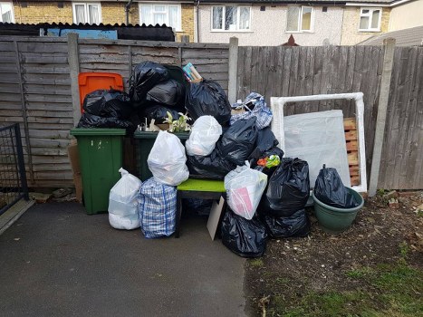 North London waste collection trucks in action