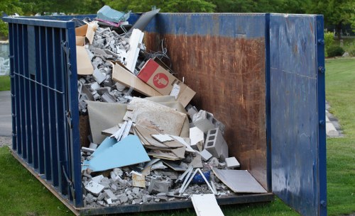 Waste clearance professionals removing household items from a North London home